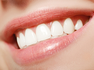 Close-up of bright white teeth and healthy gums, representing teeth whitening and cosmetic dentistry results