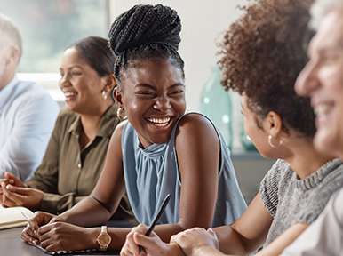 Protecting Your Systemic Health CEREC Group of adults smiling and chatting, representing welcoming dental office and positive patient experience