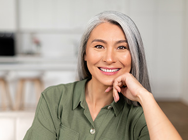 What to expect at your dentures appointments Older woman smiling confidently, representing healthy smile results from restorative or cosmetic dentistry